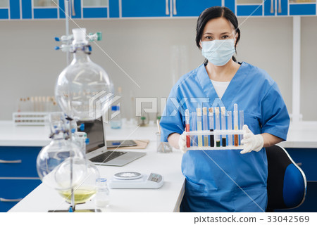 Professional lab worker looking at you 33042569