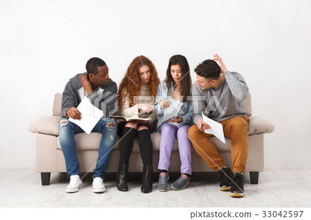 Diverse young students preparing for exam at home 33042597
