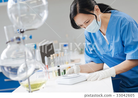 Smart professional chemist using electronic scales 33042605