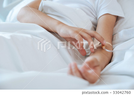 Close up of a catheter being inserted in vein Close up of a catheter being inserted in vein 33042760