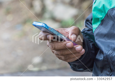 Close up of a man using mobile smart phone, copy s Close up of a man using mobile smart phone, copy s 33042957