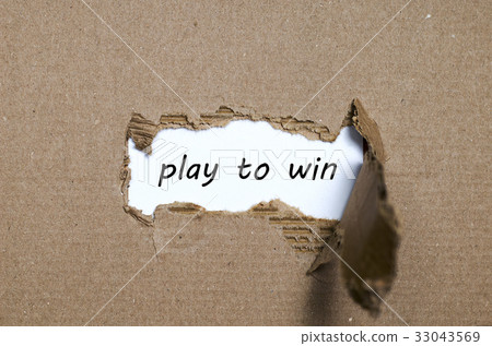The word play to win appearing behind torn paper The word play to win appearing behind torn paper 33043569