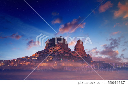 Uchisar castle on rock in ancient town, Cappadocia 33044687