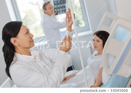 Nice professional doctor working with medical 33045008