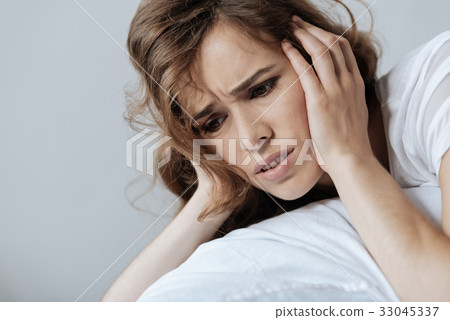 Sad cheerless woman suffering from depression Sad cheerless woman suffering from depression 33045337
