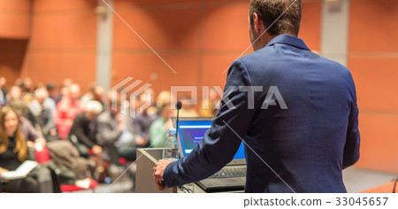 Public speaker giving talk at Business Event. 33045657