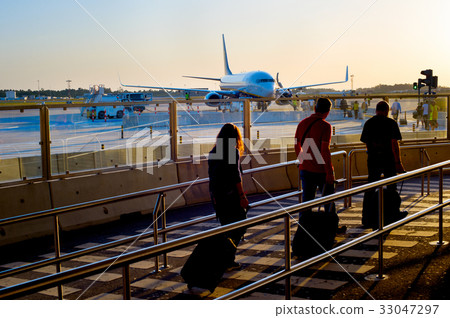 Boarding plane at airport 33047297