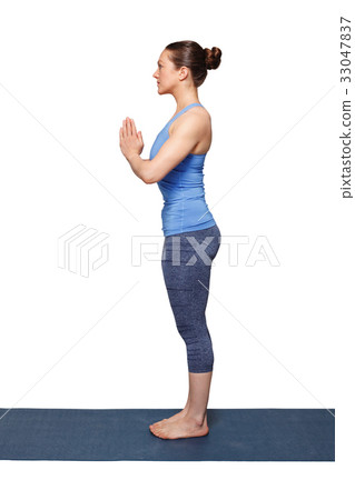 Woman doing Hatha Yoga asana Tadasana Woman doing Hatha Yoga asana Tadasana 33047837