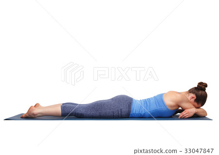 Womand relax in Hatha yoga asana Makarasana Womand relax in Hatha yoga asana Makarasana 33047847