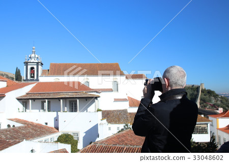 Tourist photographing Orbis Portugal Tourist photographing Orbis Portugal 33048602