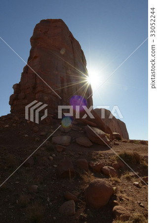 Backlit butte-shaped monument Backlit butte-shaped monument 33052244