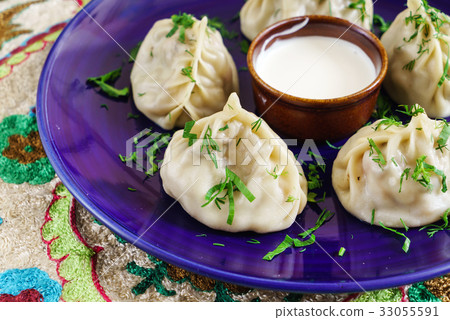 Dumplings, Manti - traditional meat dish of Central Asia, Turkey, Mongolia, Korea.. Dumplings, Manti - traditional meat dish of Central Asia, Turkey, Mongolia, Korea.. 33055591