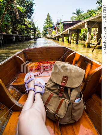 woman sitting on canal boat in floating market 33057054