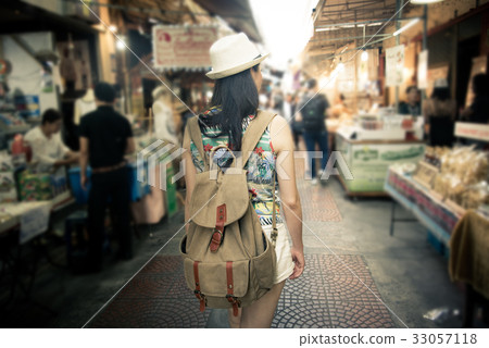 woman tourist walking in Amphawa street woman tourist walking in Amphawa street 33057118
