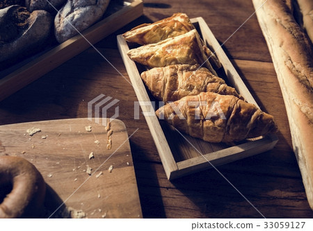 Variety of Fresh Baked Bakery on Wooden Table Variety of Fresh Baked Bakery on Wooden Table 33059127