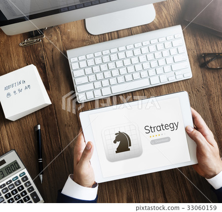 Businessman using tablet with game online download Businessman using tablet with game online download 33060159