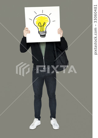 Man holding banner with light bulb symbol cover his face Man holding banner with light bulb symbol cover his face 33060481