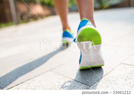 Woman run in a city Woman run in a city 33061212
