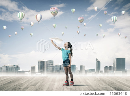 Concept of careless happy childhood with girl dreaming about som 33063648