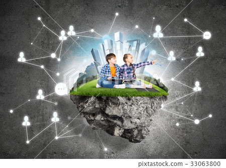 Two kids of school age with book exploring this great world Two kids of school age with book exploring this great world 33063800