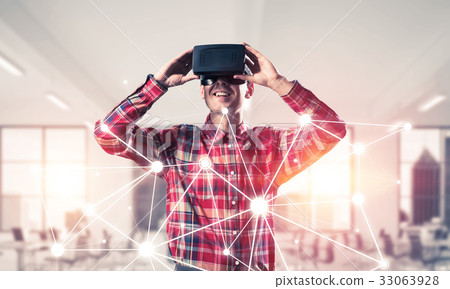 Guy wearing checked shirt and virtual mask demonstrating some em Guy wearing checked shirt and virtual mask demonstrating some em 33063928