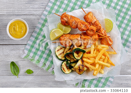 tasty chicken shish kebabs on skewers 33064110