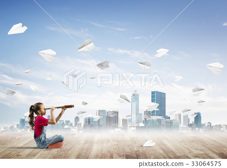 Concept of careless happy childhood with girl looking in spyglass Concept of careless happy childhood with girl looking in spyglass 33064575