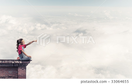 Concept of careless happy childhood with girl showing touch gest Concept of careless happy childhood with girl showing touch gest 33064655