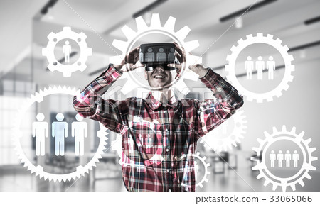 Guy wearing checked shirt and virtual mask demonstrating some em 33065066