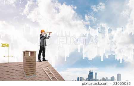 Engineer man standing on roof and looking in spyglass. Mixed media Engineer man standing on roof and looking in spyglass. Mixed media 33065085