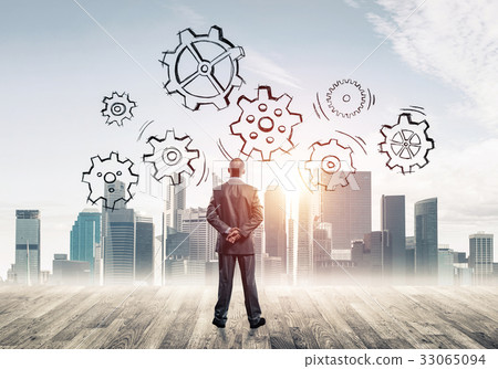 Cogwheel engine drawn on screen as symbol for teamwork and coope 33065094