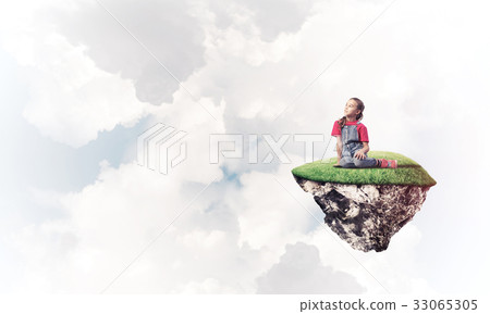Concept of careless happy childhood with girl dreaming about som Concept of careless happy childhood with girl dreaming about som 33065305