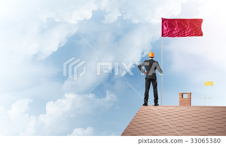 Young businessman with flag presenting concept of leadership. Mixed media Young businessman with flag presenting concept of leadership. Mixed media 33065380