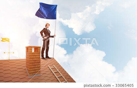 Young businessman with flag presenting concept of leadership. Mixed media 33065405