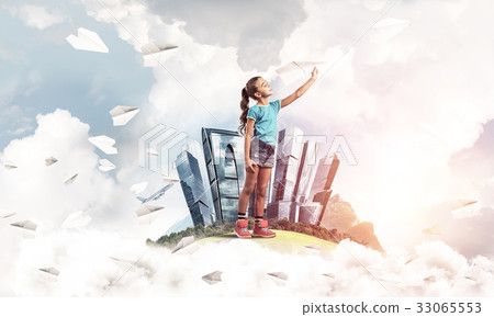 Concept of careless happy childhood with girl dreaming about fut 33065553