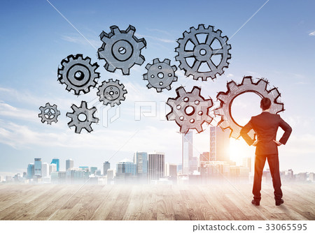 Cogwheel engine drawn on screen as symbol for teamwork and cooperation 33065595