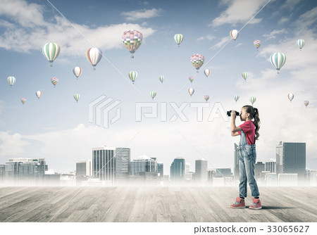 Concept of careless happy childhood with girl looking in binocul 33065627
