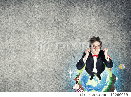 Businessman on Earth globe 33066089