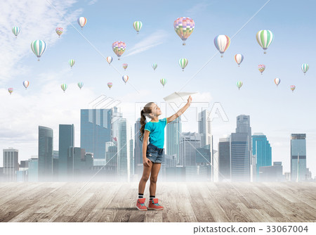 Concept of careless happy childhood with girl dreaming about something Concept of careless happy childhood with girl dreaming about something 33067004