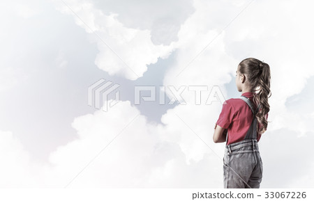 Concept of careless happy childhood with girl looking in future Concept of careless happy childhood with girl looking in future 33067226