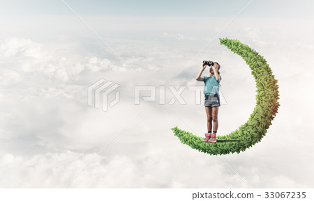 Concept of careless happy childhood with girl on green moon Concept of careless happy childhood with girl on green moon 33067235