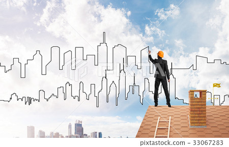 Man architect draw silhouette of modern city on blue sky. Mixed media Man architect draw silhouette of modern city on blue sky. Mixed media 33067283