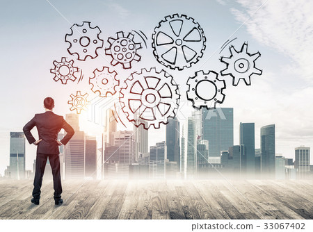 Cogwheel engine drawn on screen as symbol for teamwork and coope 33067402