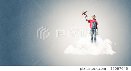 Concept of careless happy childhood with girl dreaming to become Concept of careless happy childhood with girl dreaming to become 33067646