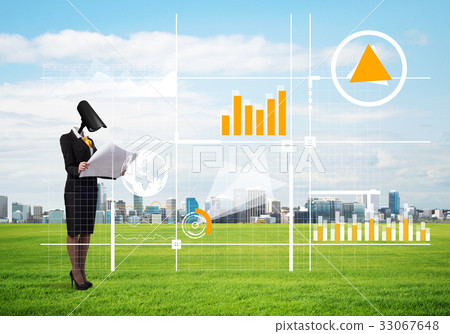 Camera headed woman standing on green grass against modern cityscape 33067648