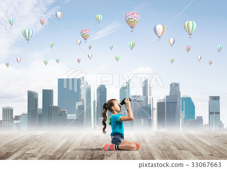 Concept of careless happy childhood with girl looking in binoculars 33067663