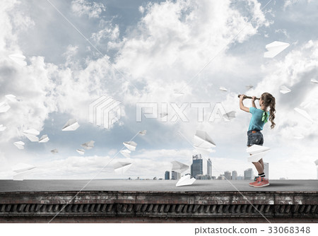 Concept of careless happy childhood with girl exploring this wor Concept of careless happy childhood with girl exploring this wor 33068348