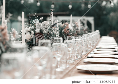 Glasses on the festive table setting. Wedding Glasses on the festive table setting. Wedding 33068911