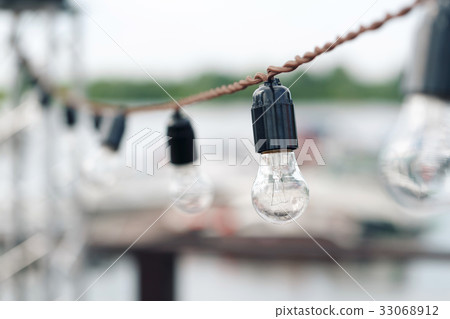 Incandescent bulbs Mountain Lake background Incandescent bulbs Mountain Lake background 33068912