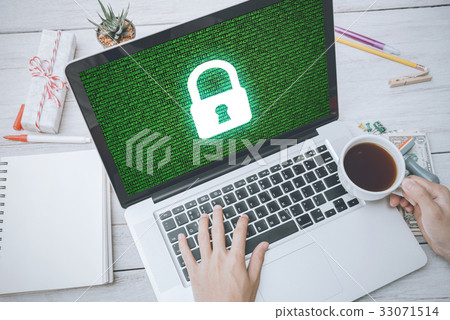 hand typing on keyboard with cyber security 33071514